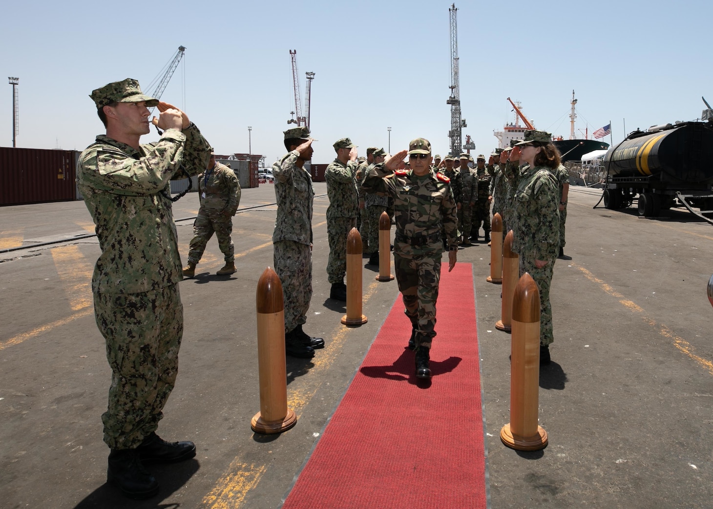 Sideboys assigned to the Arleigh Burke-class guided-missile destroyer USS Porter (DDG 78), welcome aboard Brigadier General Abdellatif Malek J2, from the Royal Moroccan Armed Forces during exercise African Lion 22, June 28, 2022.