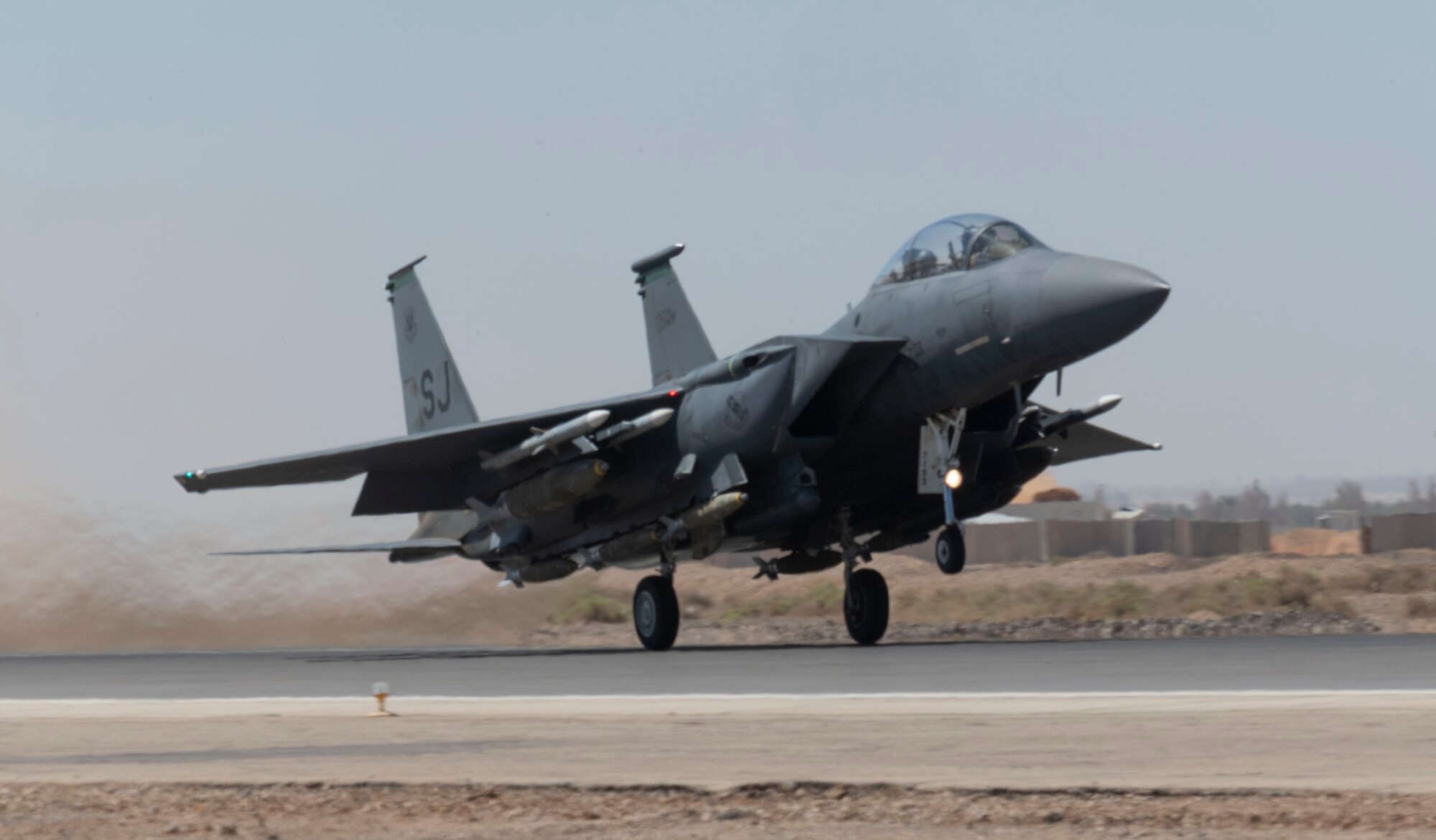 A 332d Air Expeditionary Wing F-15E Strike Eagle lifts off from runway during a routine training exercise at an undisclosed location in Southwest Asia, July 7, 2022. The F-15E is a dual-role fighter designed to perform air-to-air and air-to-ground missions with an array of avionics and electronics systems that give it the capability to fight at low altitude, day or night and in all weather. (U.S. Air Force photo by Technical Sgt. Jeffery Foster)