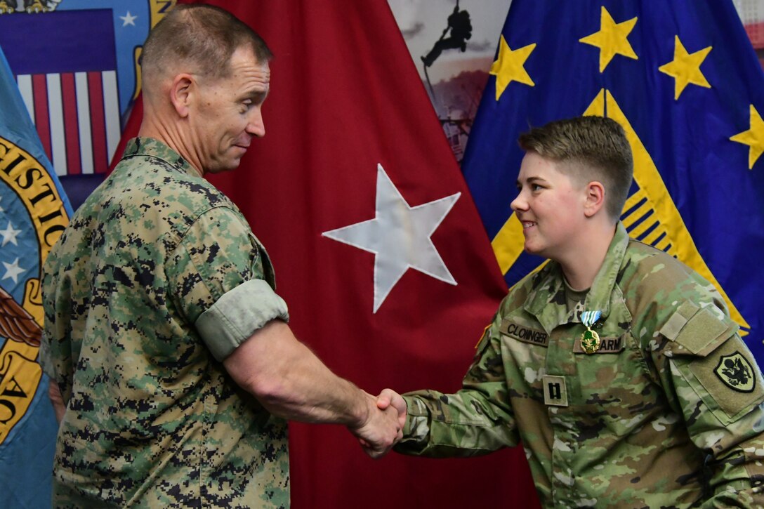 Maj. Gen. Revenltlow shakes hand of Capt. Cloninger