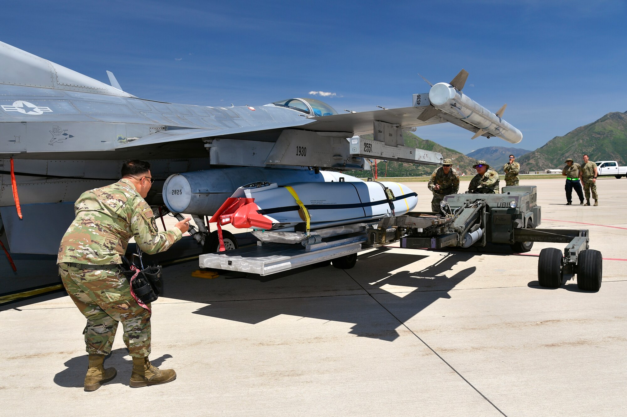 Airmen with the Air National Guard Air Force Reserve Command Test Center (AATC) load a Joint Air-to-Surface Standoff Missile (JASSM) on a pre-block F-16 for a test launch. This is the first time a JASSM has been launched from a pre-block F-16, a model flown by Air National Guard and Air Force Reserve units.