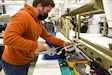 A biomedical equipment technician works on a portable centrifuge at the U.S. Army Medical Materiel Agency’s Medical Maintenance Operations Division at Tobyhanna Army Depot, Pennsylvania.