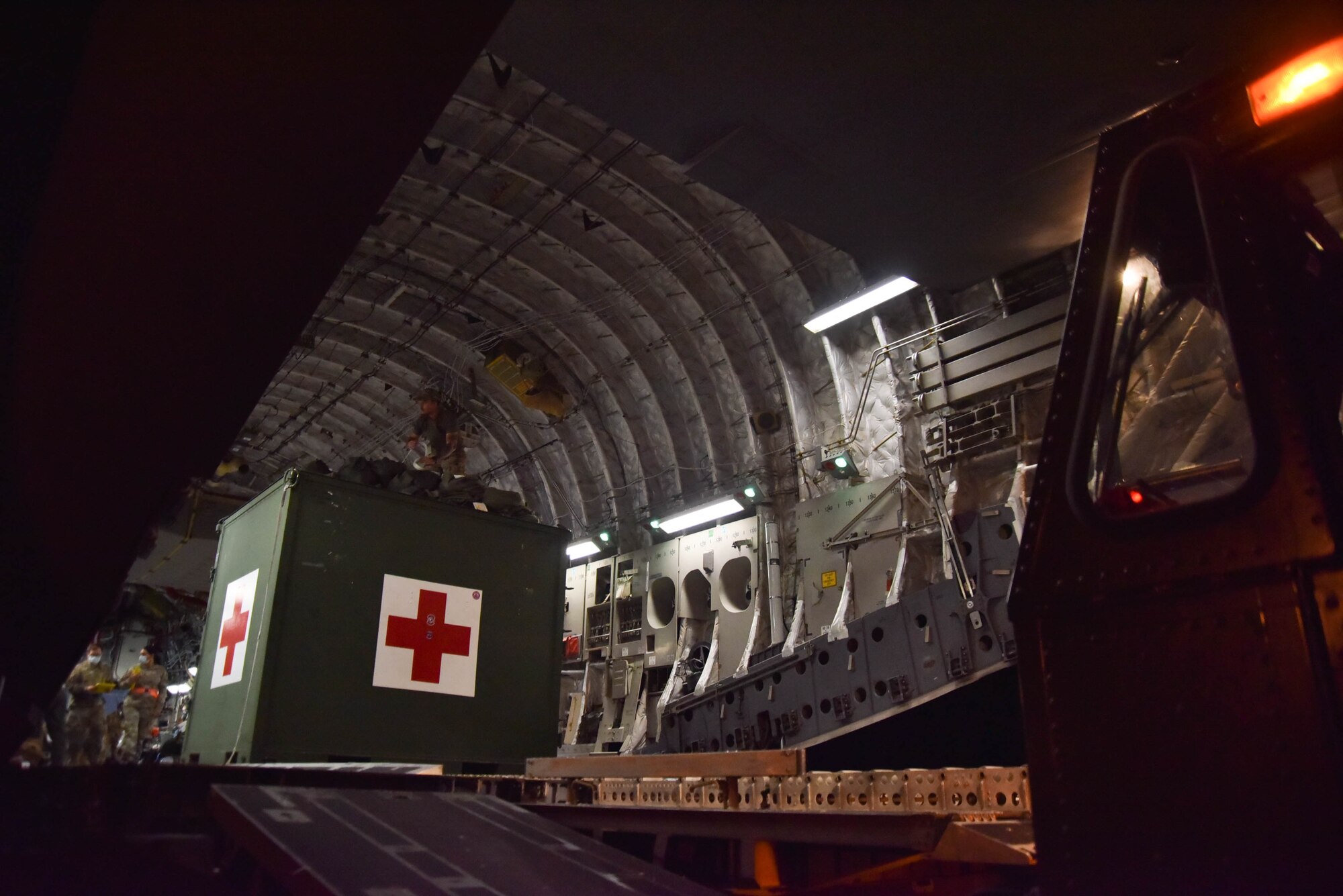 Wounded service members aboard a C-17 Globemaster 3 prepare to ride medical transport buses to the En-Route Patient Staging Facility at Joint Base Andrews, Md., July 7, 2022.