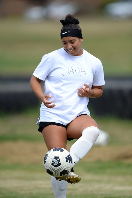 Woman plays soccer.