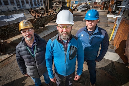 Sensor installation project team members include (l to r) Kevin Boyle, APLM, Code 1000.1, Technology Insertion Office, Ben Grisso, structural health monitoring R&D lead, Naval Surface Warfare Center Carderock Division, and Seth Kessler, principal investigator, Metis Design Corporation. (U.S. Navy photo by Scott Hansen)