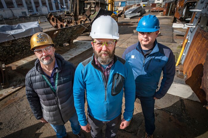 Sensor installation project team members include (l to r) Kevin Boyle, APLM, Code 1000.1, Technology Insertion Office, Ben Grisso, structural health monitoring R&D lead, Naval Surface Warfare Center Carderock Division, and Seth Kessler, principal investigator, Metis Design Corporation. (U.S. Navy photo by Scott Hansen)