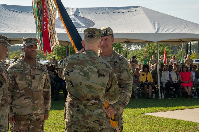 U.S. Central Command's Commander, Gen. Michael E. Kurilla, passes the U.S. Army Central colors to incoming USARCENT's Commanding General, Lt. Gen. Patrick D. Frank, during the change of command ceremony at Patton Hall's Lucky Park, Shaw Air Force Base, S.C., July 7, 2022. During the ceremony, Frank assumed command from outgoing Commanding General, Lt. Gen. Ronald P. Clark