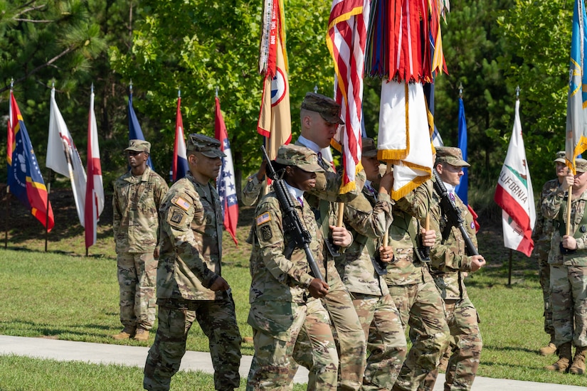 U.S. Army Central's Senior Enlisted Advisor, Command Sgt. Maj. J. Garza, escorts the colors during USARCENT's change of command ceremony at Patton Hall's Lucky Park, Shaw Air Force Base, S.C., July 7, 2022.