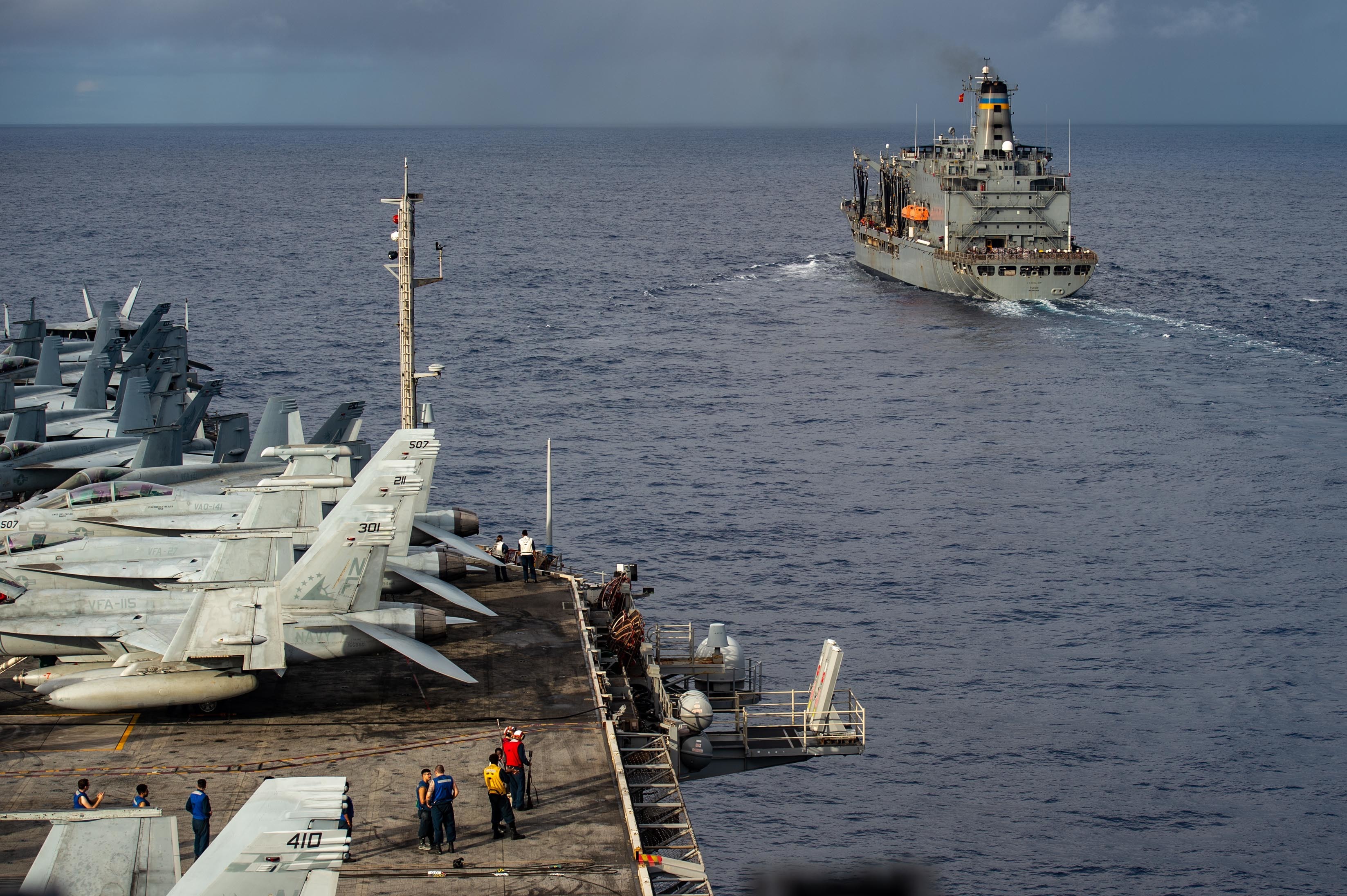 The U.S. Navy's only forward-deployed aircraft carrier USS Ronald Reagan (CVN 76) approaches the Military Sealift Command fleet replenishment oiler USNS Yukon (T-AO 202) to conduct a replenishment-at-sea.