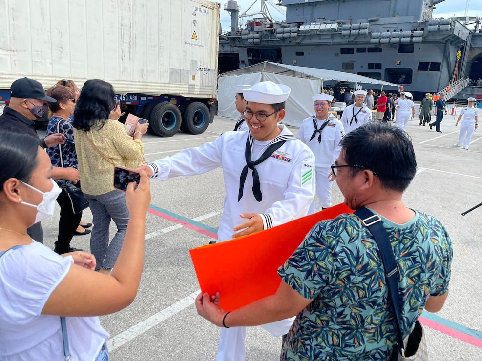 NAVAL BASE GUAM (June 23, 2022) - Nimitz-class aircraft carrier USS Ronald Reagan (CVN 76) arrived at U.S. Naval Base Guam as part of a scheduled port visit, June 23 on their first port call of 2022. Ronald Reagan is forward deployed to Yokosuka, Japan. Guam-based Sailors were greeted by their families upon the carrier's arrival.