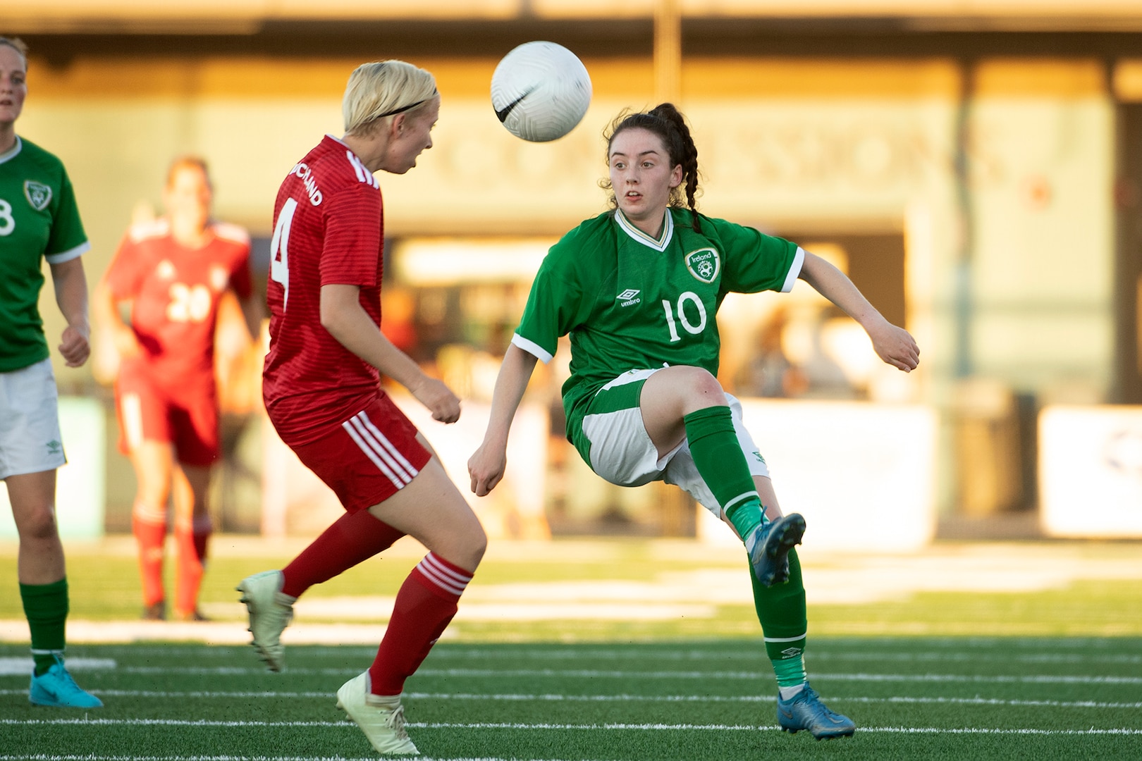 Ireland’s Lt. Angela McGuigan, right, kicks a ball past Germany’s OR-5 Alexandra De Lucia during the second round of opening night for the  13th CISM (International Military Sports Council) World Military Women’s Football Championship in Meade, Washington July 11, 2022.  Germany beat Ireland 3-0. (DoD photo by EJ Hersom)