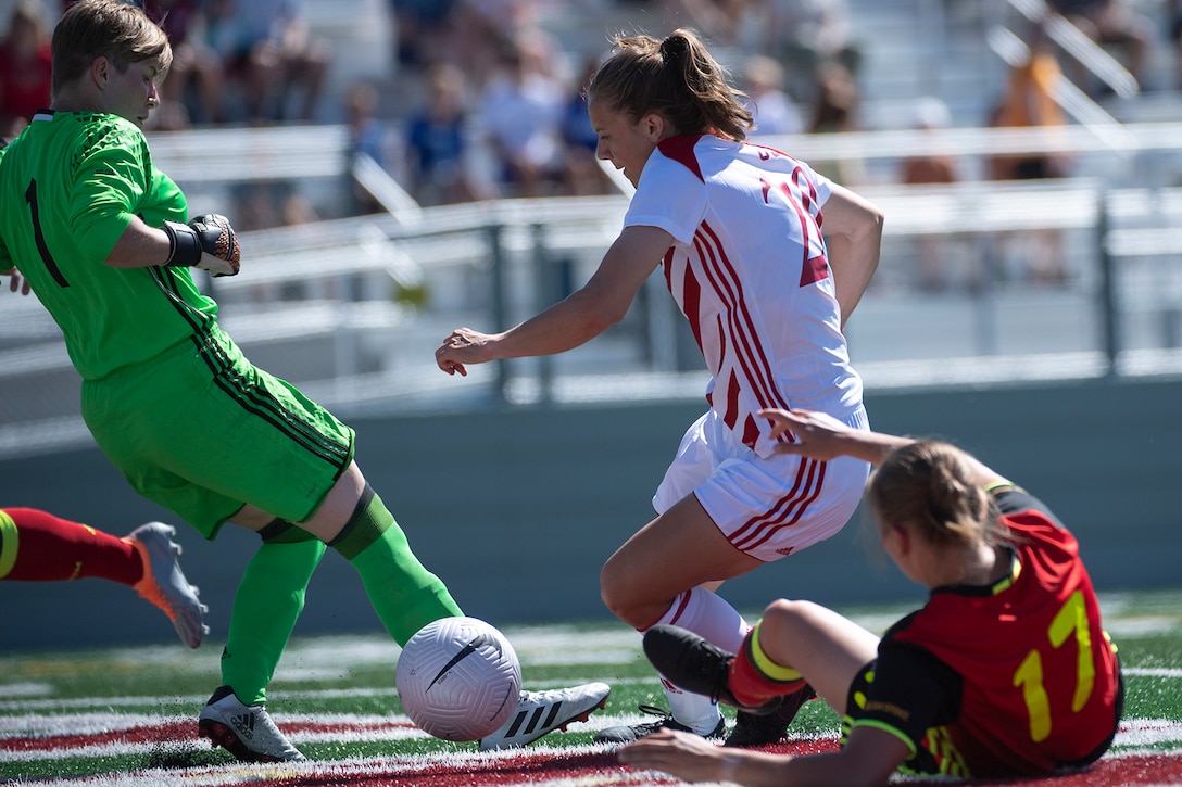 Army Capt. Kailey Utley of the U.S. U.S. Armed Forces Women’s Soccer Team makes a scoring drive against Belgium in the opening match of the 13th CISM (International Military Sports Council) World Military Women’s Football Championship in Meade, Washington July 11, 2022.  (DoD photo by EJ Hersom)