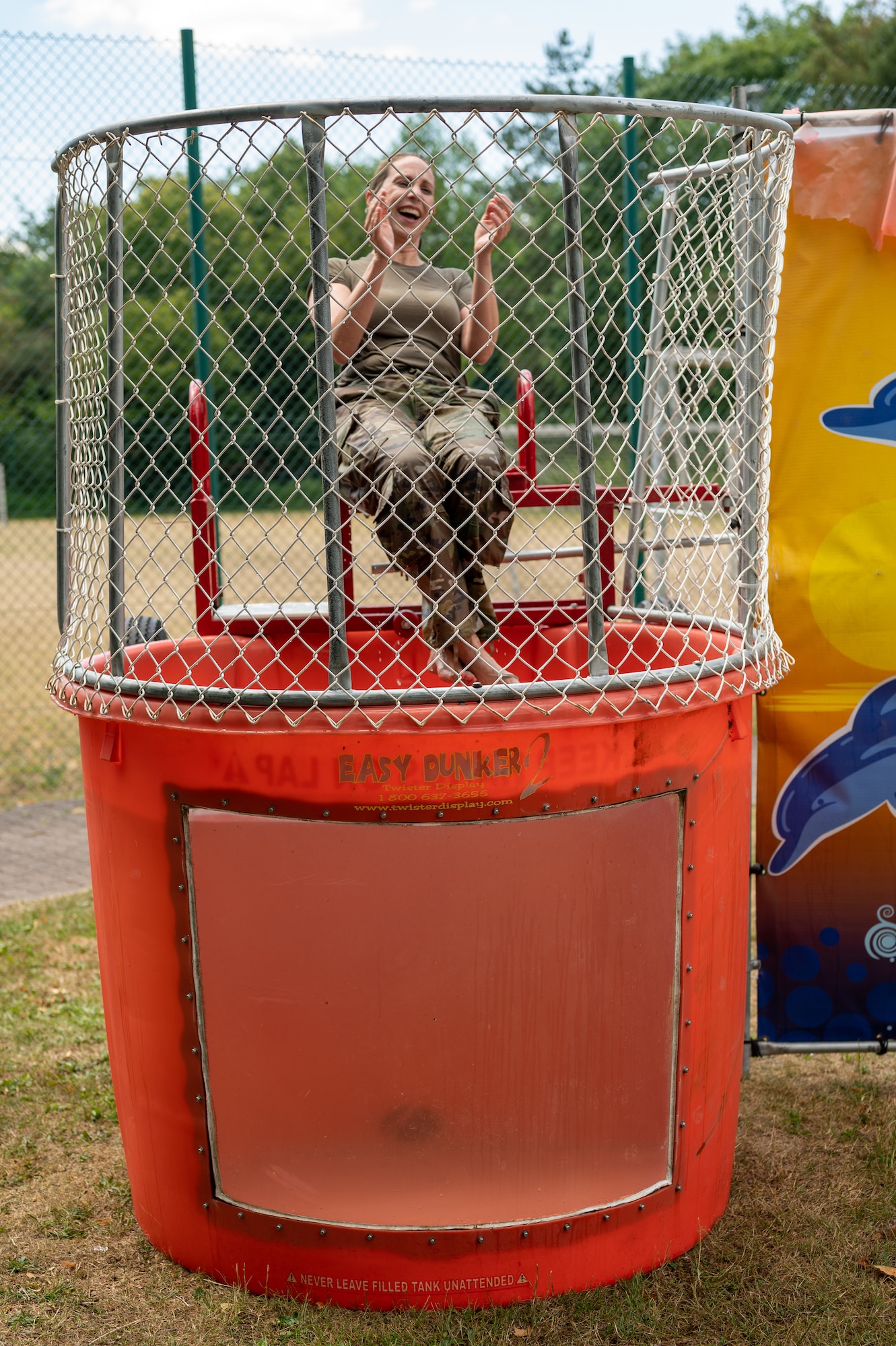 A person sitting in a dunk tank.