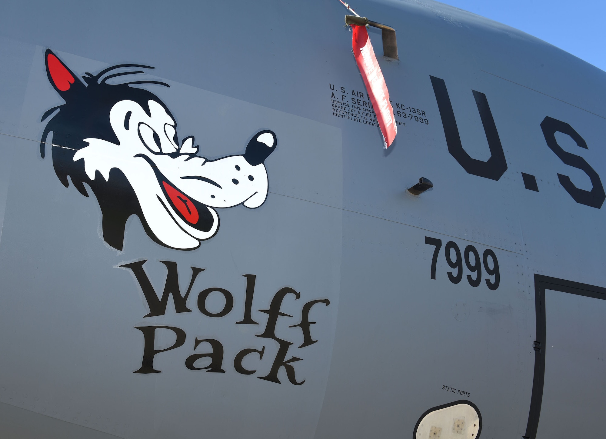 Heritage nose art “Wolff Pack” is displayed on one of the 100th Air Refueling Wing’s KC-135 Stratotanker aircraft at Royal Air Force Mildenhall Feb. 26, 2021. The nose art is based on World War II designs of the 100th Bomb Group, based at Thorpe Abbotts, Diss, England. Captain (ret.) Robert “Bob” Wolff was a B-17 Flying fortress pilot with the 418th Bomb Squadron, 100th BG, who flew seven combat missions out of Thorpe Abbotts. The KC-135 nose art was dedicated to Wolff in May 2021, on the 67th anniversary of Victory in Europe Day. (U.S. Air Force photo by Karen Abeyasekere)
