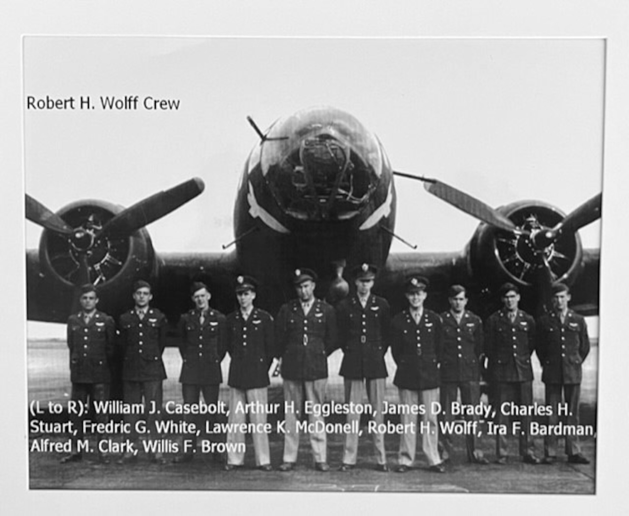 U.S. Army Air Forces 2nd Lt. Robert “Bob” Wolff, fourth right, and his crew pose for a photo by a B-17 Flying Fortress training aircraft in the United States June 1, 1943. Wolff was a B-17 pilot with the 100th Bomb Group, Thorpe Abbotts, England, and along with his crew, was kept as a prisoner-of-war at Stalag Luft III, Germany, for approximately 18 months. (Photo courtesy of Bob Wolff and 100th Bomb Group Foundation website)