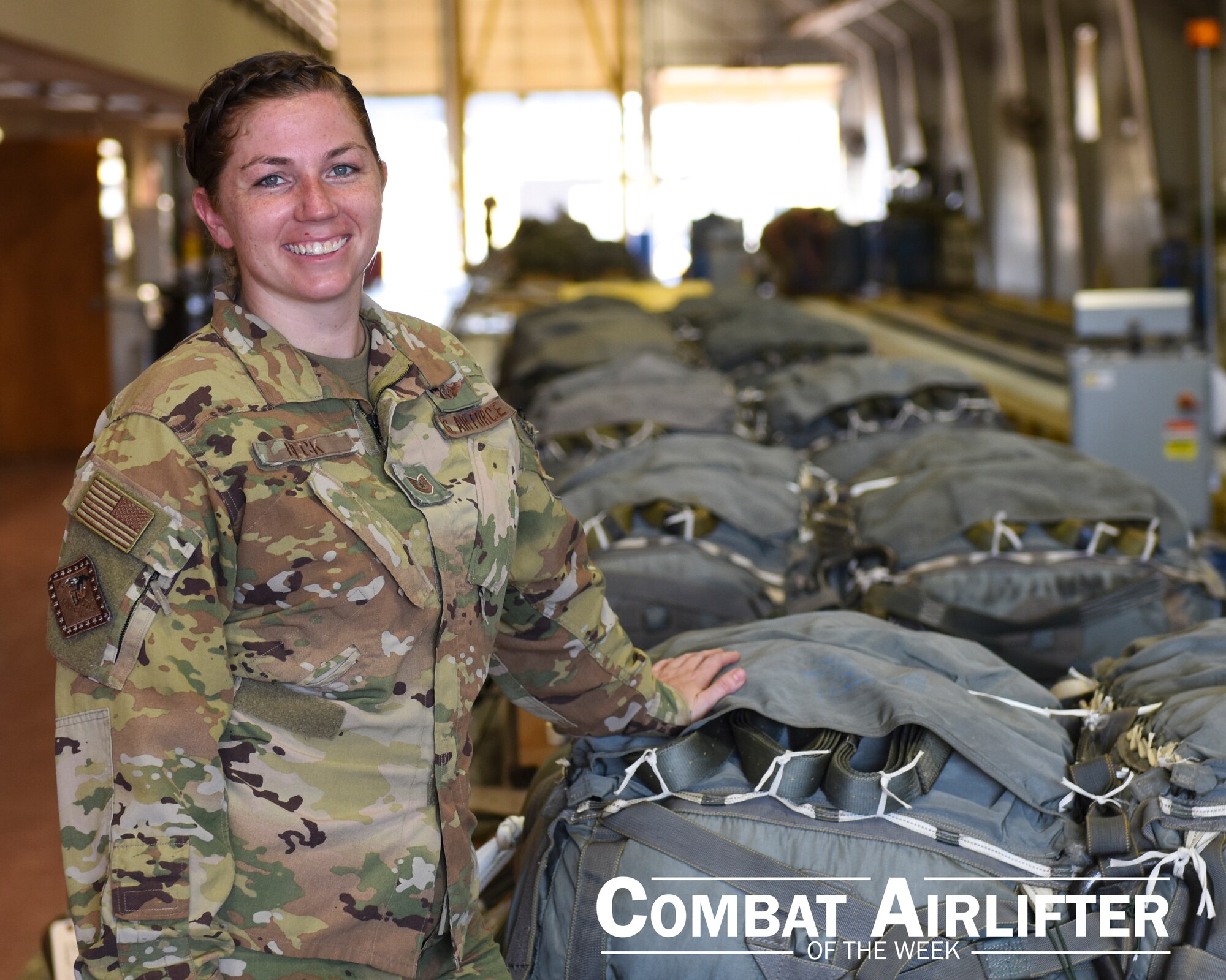 A woman in uniform poses for a photo.