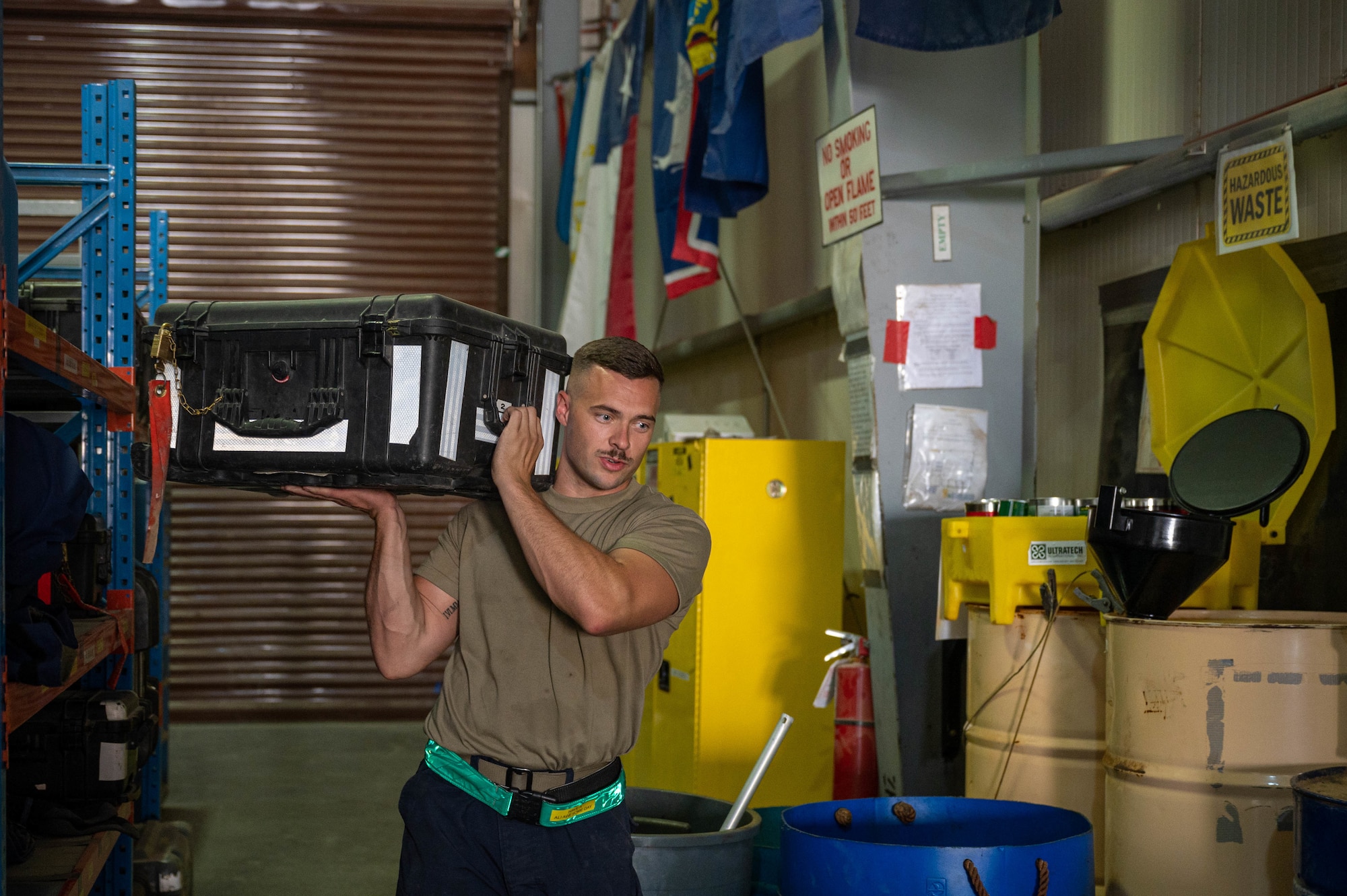 U.S. Air Force Senior Airman Daniel Logan Hopton, a composite tool kit technician and fuel system mechanic with the 386th Expeditionary Aircraft Maintenance Squadron Sortie Support Component Equipment Maintenance Flight, retrieves a tool kit from a shelf at Ali Al Salem Air Base, June 23, 2022. The kits are often checked out of the shop by various specialty shops and coalition partners to perform maintenance on their aircraft. (U.S. Air Force photo by Senior Airman Natalie Filzen)