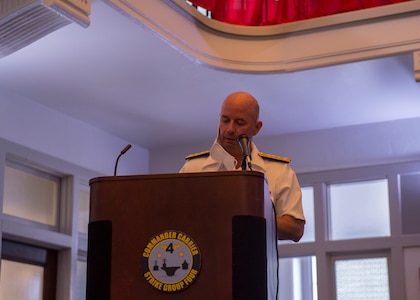 Rear Adm. Jeffery Czerewko, left, relives Rear Adm. Richard Brophy as the commander of Carrier Strike Group (CSG) 4 during a change of command ceremony.