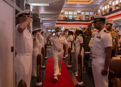 Rear Adm. Jeffery Czerewko, left, relives Rear Adm. Richard Brophy as the commander of Carrier Strike Group (CSG) 4 during a change of command ceremony.