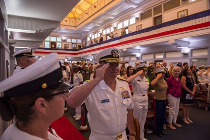 Rear Adm. Jeffery Czerewko, left, relives Rear Adm. Richard Brophy as the commander of Carrier Strike Group (CSG) 4 during a change of command ceremony.