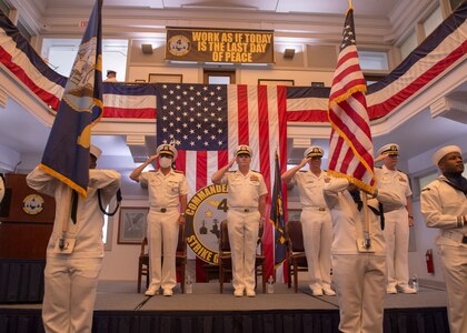 Rear Adm. Jeffery Czerewko, left, relives Rear Adm. Richard Brophy as the commander of Carrier Strike Group (CSG) 4 during a change of command ceremony.