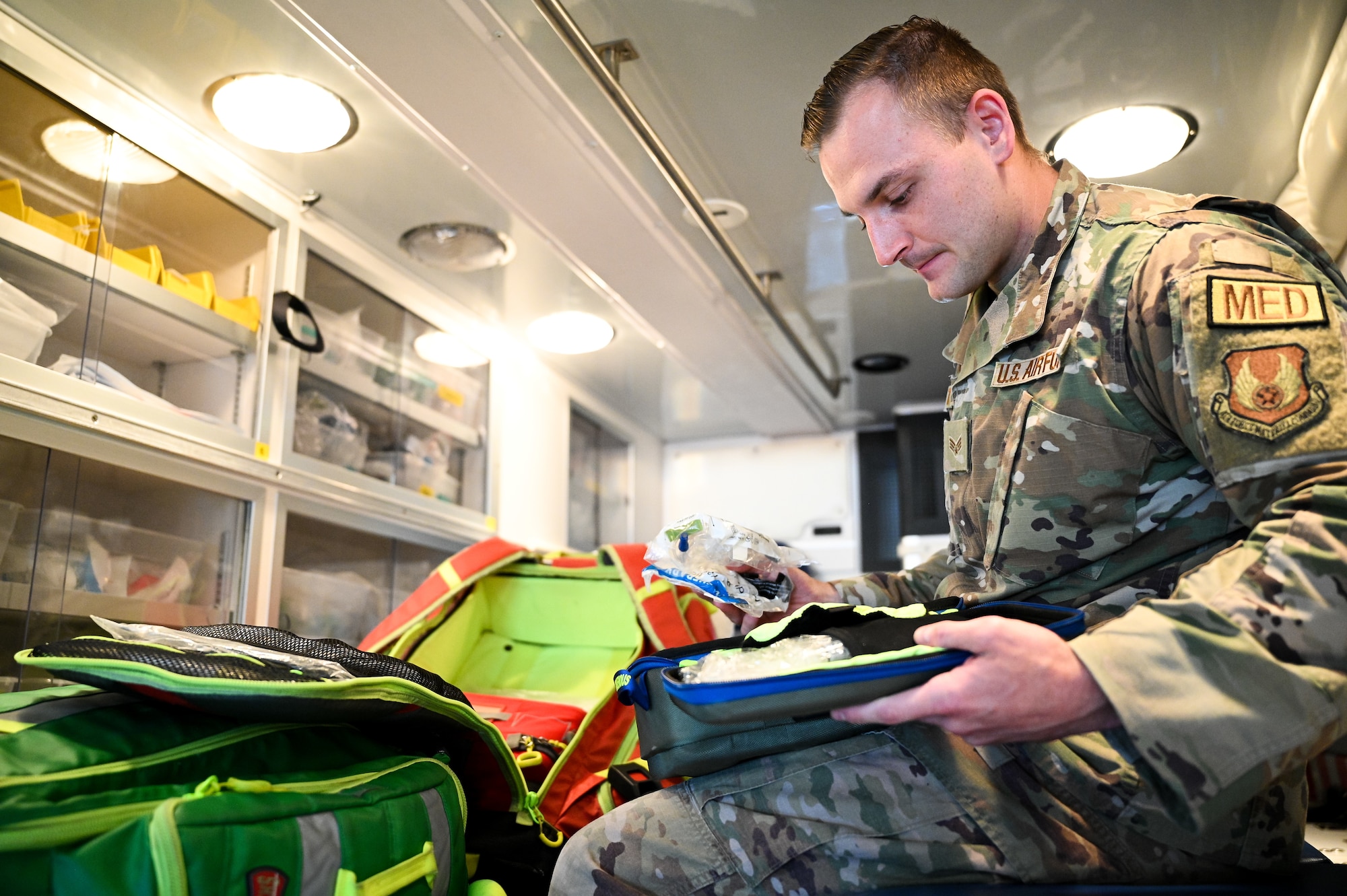 Senior Airman Jacob Tyner, 75th Medical Group, inventories medical supplies aboard an ambulance at Hill Air Force Base, Utah, May 25, 2022. Airmen with the 75th MDG stay mission ready by crewing Hill AFB's ambulance alongside firefighters from the 775th Civil Engineer Squadron's Fire and Emergency Services flight. By providing hands-on emergency and pre-hospital care to patients, medics get the opportunity to use skills the don't use in the base clinic. (U.S. Air Force photo by R. Nial Bradshaw)