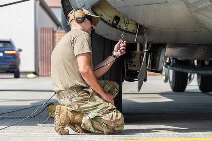 Airmen assigned to the 139th Maintenance Group, Missouri Air National Guard, perform a preflight check on a C-130 Hercules aircraft at Ramstein Air Base, Germany, June 28, 2022. The 139th Airlift Wing was the lead unit for Task Force Iron Herk II, providing airlift support for European Command’s area of responsibility.