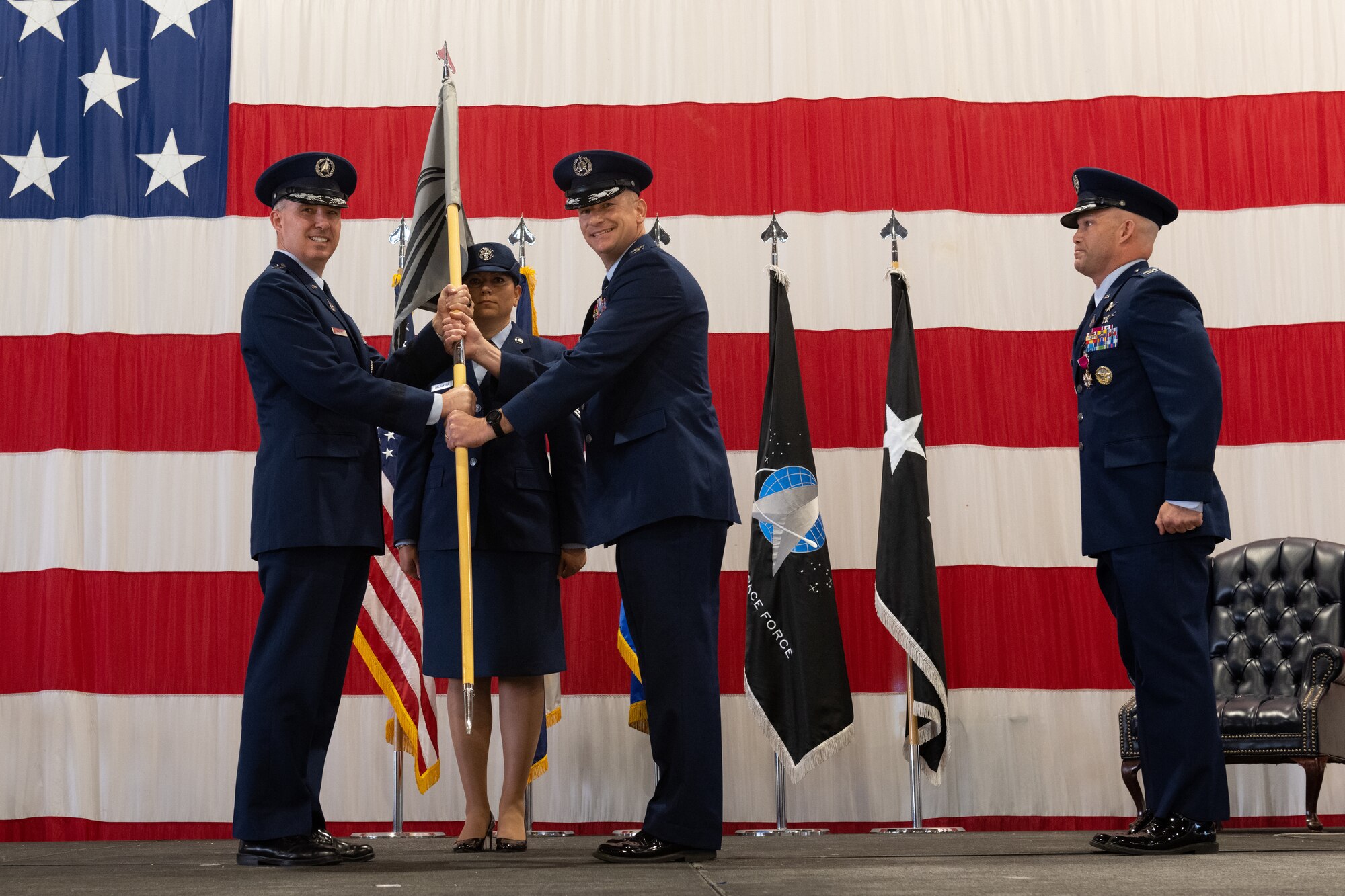 Leaders pose for a photo during a change of command ceremony