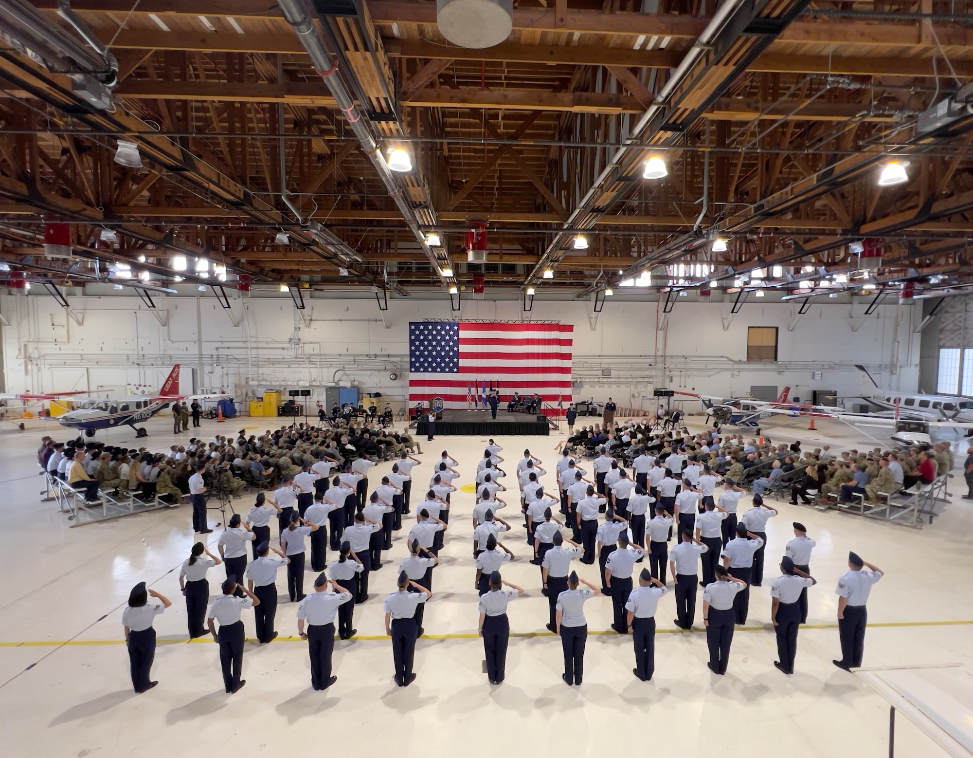A flight salute the outgoing commander during change of command ceremony