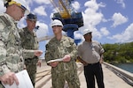 Vice Adm. Bill Galinis (third from left), Commander of Naval Sea Systems Command, visits with leadership from Pearl Harbor Naval Shipyard and Intermediate Maintenance Facility in May, to assess the command’s alignment and progress on implementing the U.S. Navy’s Naval Sustainment System – Shipyard performance improvement initiatives while conducting a review of shipyard operations in Hawaii. (Official U.S. Navy photo by Marc Ayalin)