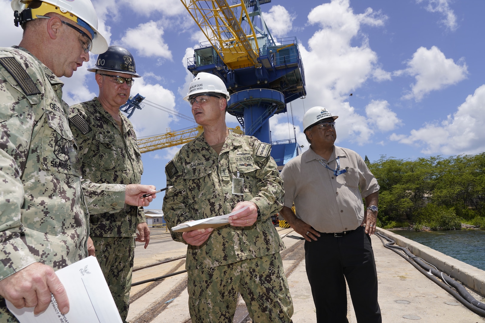 Vice Adm. Bill Galinis (third from left), Commander of Naval Sea Systems Command, visits with leadership from Pearl Harbor Naval Shipyard and Intermediate Maintenance Facility in May, to assess the command’s alignment and progress on implementing the U.S. Navy’s Naval Sustainment System – Shipyard performance improvement initiatives while conducting a review of shipyard operations in Hawaii. (Official U.S. Navy photo by Marc Ayalin)