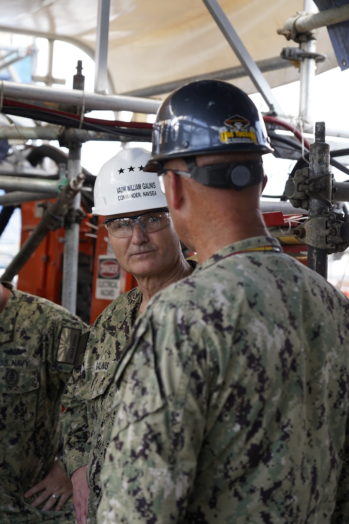 Vice Adm. Bill Galinis, Commander of Naval Sea Systems Command (NAVSEA), discusses maintenance projects with Lt. Cmdr. D. Litz, Executive Officer, USS Tucson (SSN-770), May 13, 2022. 

Galinis along with Ms. Giao Phan, Executive Director for NAVSEA visited Pearl Harbor Naval Shipyard and Intermediate Maintenance Facility to assess the alignment and progress on implementing the U.S. Navy’s Naval Sustainment System – Shipyard (NSS-SY) performance improvement initiatives while conducting a review of shipyard operations in Hawaii. (Official U.S. Navy photo by Marc Ayalin)