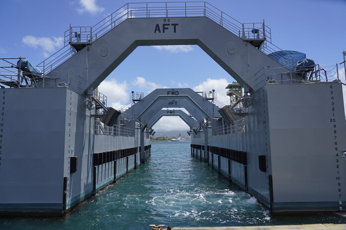 A buoyancy assist module (BAM) sits ominously along the harbor of Pearl Harbor Naval Shipyard and Intermediate Maintenance Facility May 13, 2022. BAMs are used to reduce the draft of ships allowing for easier dry docking. (Official U.S. Navy photo by Marc Ayalin)