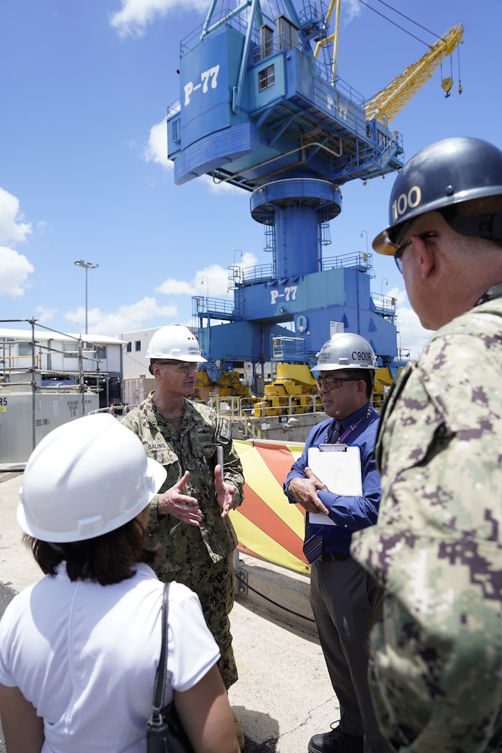 Vice Adm. Bill Galinis (rear left), Commander of Naval Sea Systems Command speaks with Chad Nakamoto (middle right), Nuclear Facilities and Equipment Manager for PHNSY & IMF, May 13, 2022. Galinis' visit assessed the command’s alignment and progress on implementing the U.S. Navy’s Naval Sustainment System – Shipyard (NSS-SY) performance improvement initiatives while conducting a review of shipyard operations in Hawaii. (Official U.S. Navy photo by Marc Ayalin)