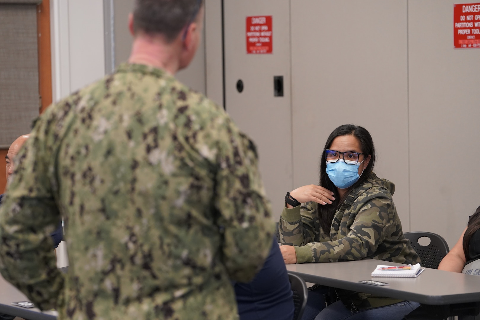 Vice Adm. Bill Galinis, Commander of Naval Sea Systems Command, discusses the U.S. Navy’s Naval Sustainment System – Shipyard initiatives with Leimakamae, welder supervisor, Shop 26, May 12, 2022. (Official U.S. Navy photo by Marc Ayalin)