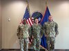 Col. Samuel Hunter and Command Sgt. Maj. Ira Ford, 658th Regional Support Group commander and command sergeant major, pose for a photo with Rear Adm. Benjamin Nicholson, the Commander of Joint Region Marianas.