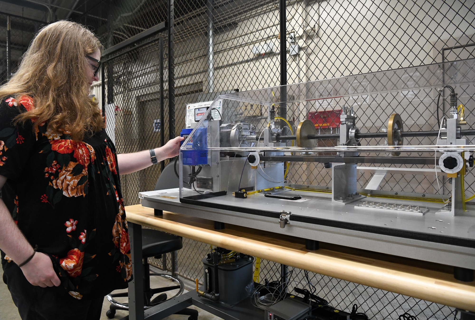 Parke Nation, an Arnold Engineering Development Complex mechanical reliability engineer, adjusts settings on a Condition-Based Maintenance Fault Simulator, June 8, 2022, at the Innovation Center at Arnold Air Force Base, Tennessee. The simulator was pitched in an AEDC Spark Tank proposal and identified as a beneficial addition to the Innovation Center for condition-based maintenance training. (U.S. Air Force photo by Jill Pickett)