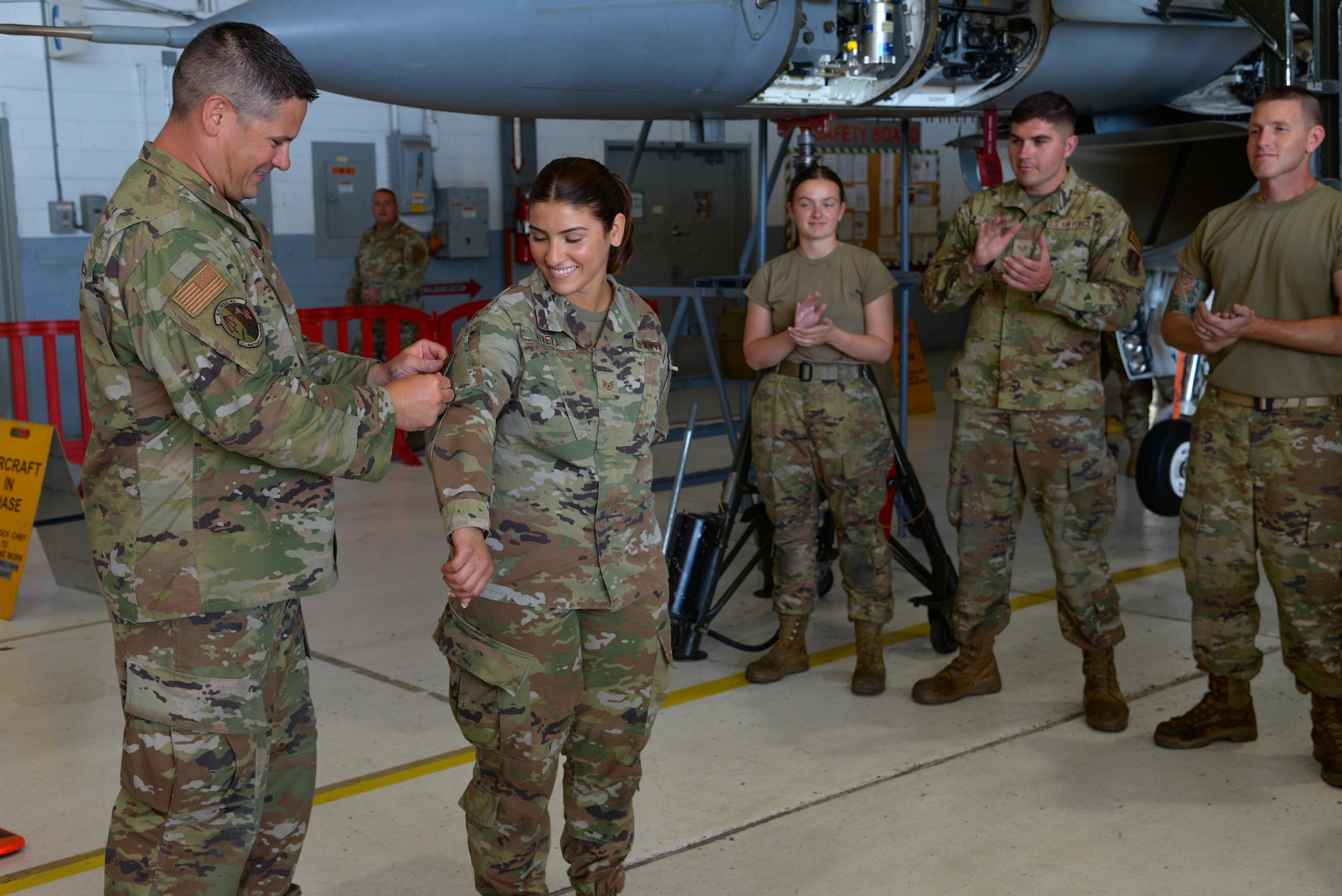 A photo of Staff Sgt. Tatiana Rivera receiving a 177th Maintenance Squadron patch after participating in the Maintainer for a Day program.