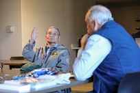 U.S. Army retired Staff Sgt. Orville Ahkinga, of Little Diomede, shares experiences from his combined 32 years of active duty and Alaska National Guard service during a state of Alaska Office of Veterans Affairs outreach event at the Aurora Inn in Nome, Alaska, July 9, 2022. The state of Alaska Office of Veterans Affairs and U.S. Department of Veterans Affairs Office of Rural Health work with rural community partners to assist eligible veterans with receiving their earned state and federal benefits. (Alaska National Guard photo by 1st Lt. Balinda O’Neal)