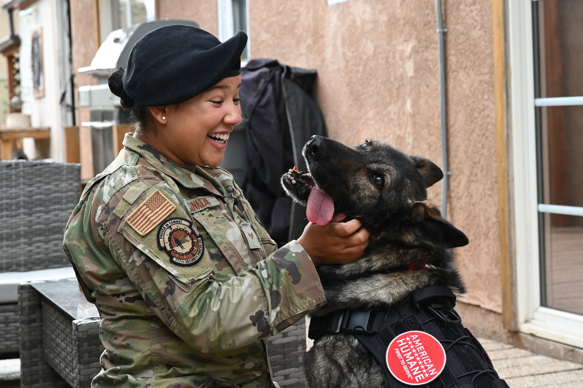 A woman hugs her dog.