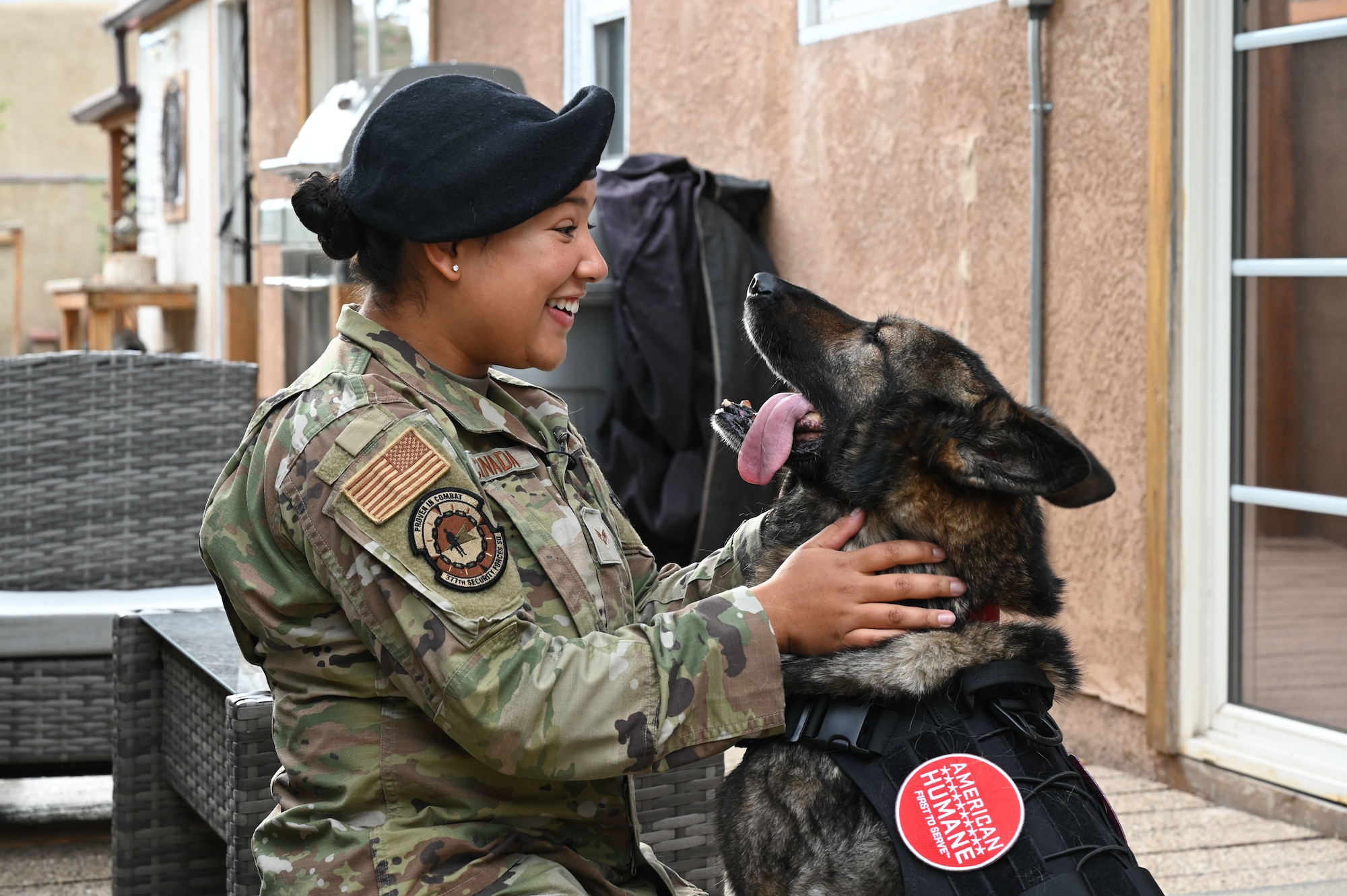 A woman hugs her dog.
