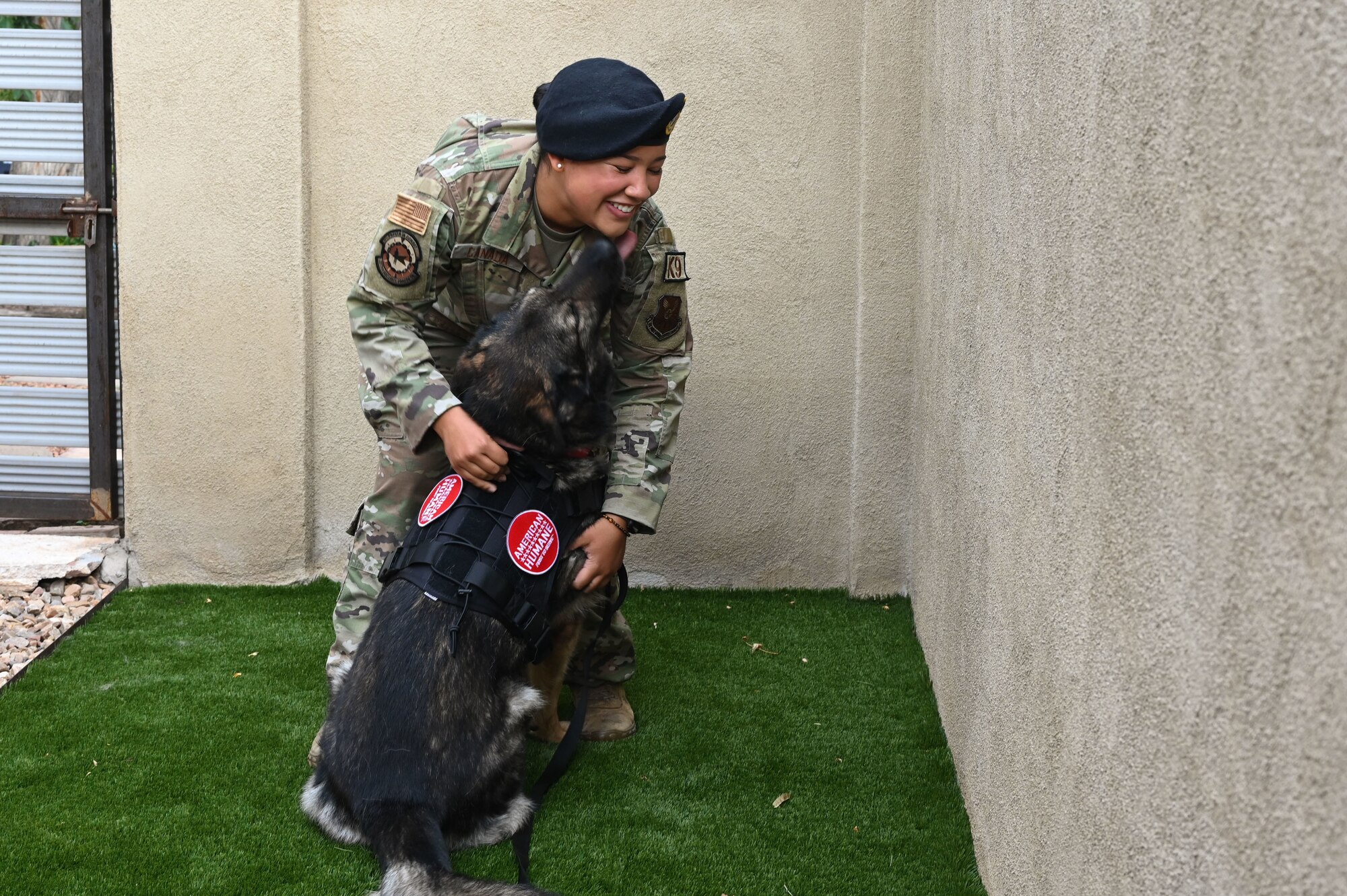 A woman hugs her dog.