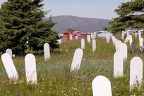 A U.S. flag waves in the wind at the Belmont Point Cemetery in Nome, July 8, 2022, where approximately 124 Alaska Territorial Guard veterans are resting in unmarked graves. The state of Alaska Office of Veterans Affairs is working with local community partners, to include the local Veterans of Foreign War Post, to ensure the graves are marked in recognition of the veteran’s service. (Alaska National Guard photo by 1st Lt. Balinda O’Neal)