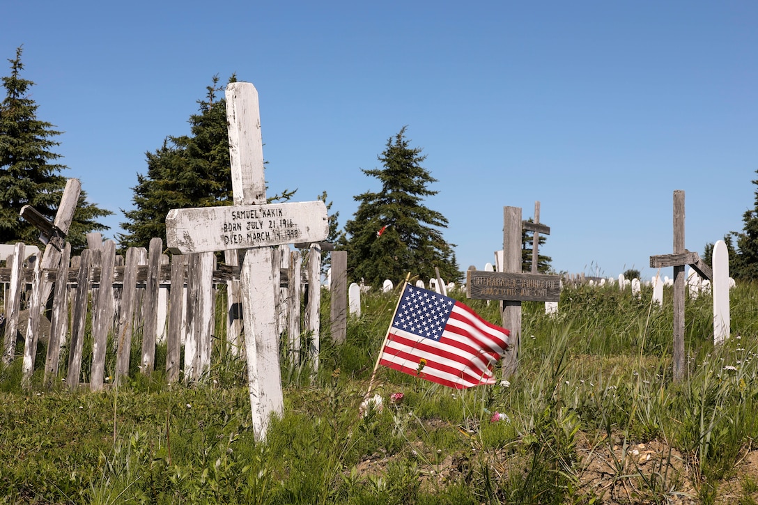 A U.S. flag waves in the wind at the Belmont Point Cemetery in Nome, July 8, 2022, where approximately 124 Alaska Territorial Guard veterans are resting in unmarked graves. The state of Alaska Office of Veterans Affairs is working with local community partners, to include the local Veterans of Foreign War Post, to ensure the graves are marked in recognition of the veteran’s service. (Alaska National Guard photo by 1st Lt. Balinda O’Neal)