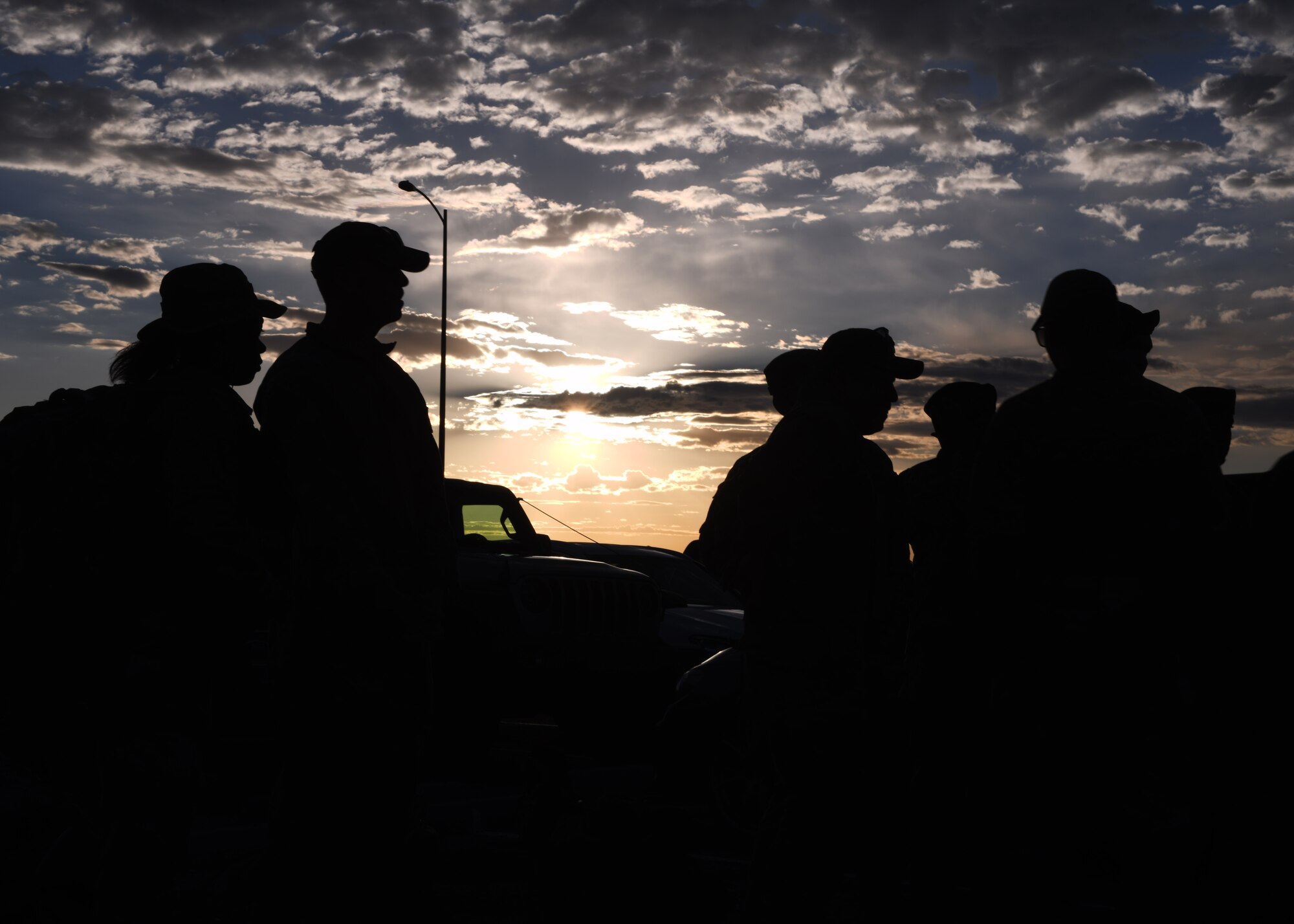 Members with the 90th Security Forces Group get their equipment ready to take on the Crow Creek Challenge, July 8th, 2022, at F.E. Warren Air Force Base, Wyo. The crow creek challenge pushed Airmen to test their physical and mental readiness. (U.S. Photo by Senior Airman Darius Frazier.)