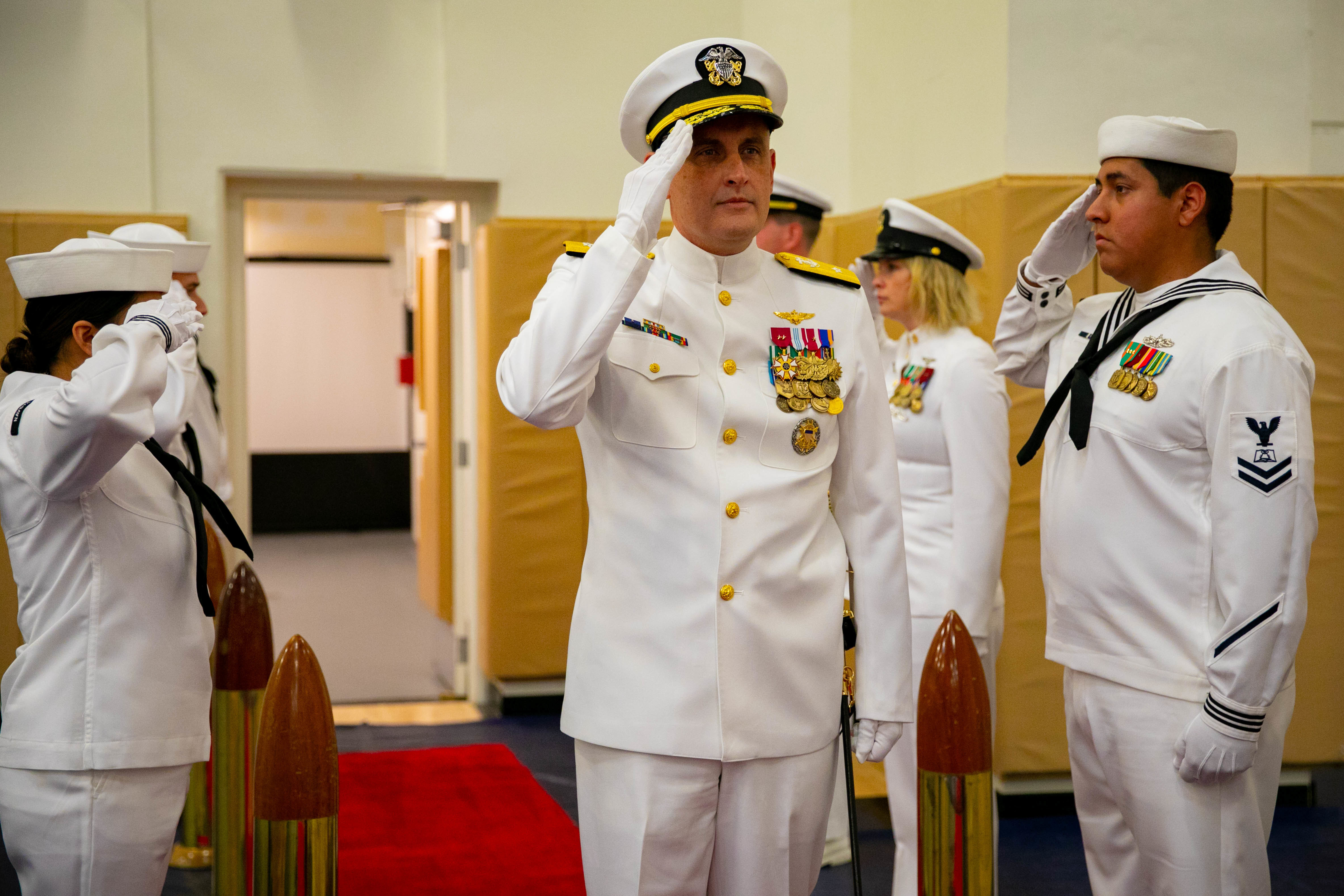 Rear Adm. Wesley McCall, commander of Navy Region Southeast, arrives with the official party during the base change of command ceremony at Naval Station Mayport, July 8, 2022.