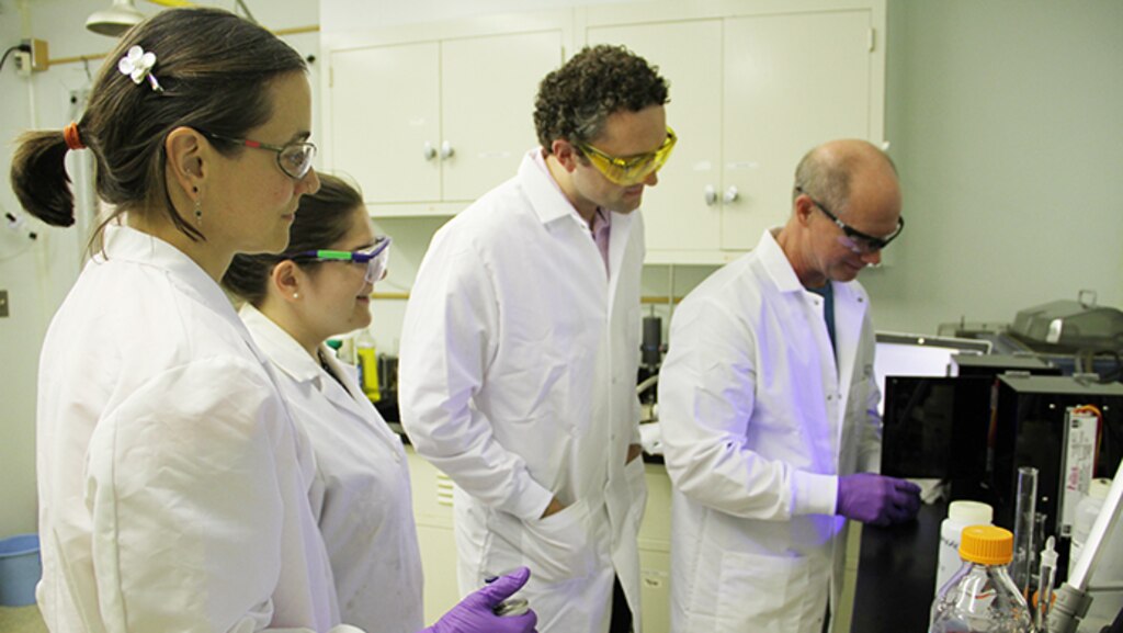 Dr. Emily Asenath-Smith, far left, and fellow team members from the U.S. Army Engineer Research and Development Center’s Cold Regions Research and Engineer Laboratory (CRREL) in Hanover, New Hampshire, and Environmental Laboratory in Vicksburg, Mississippi, look at results from their water sustainment experiment. The team will be honored during a plaque presentation ceremony later this year for their work on multi-spectral photocatalytic compounds.