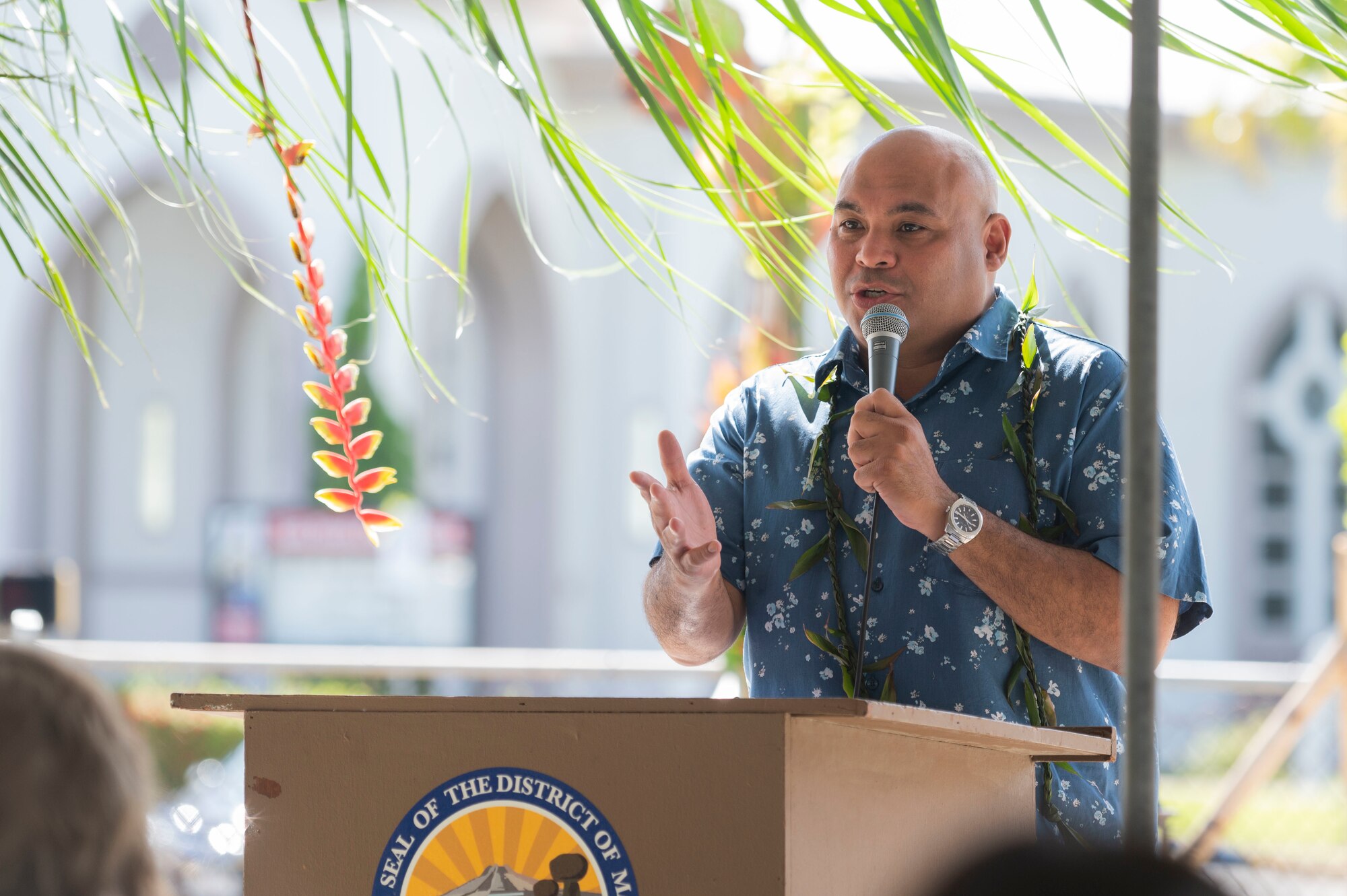A man speaking to a crowd.