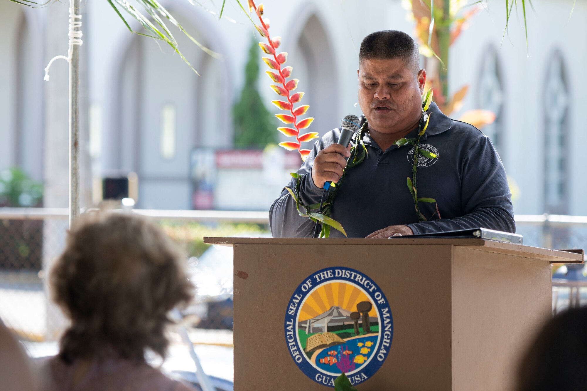 A man speaking to a crowd.