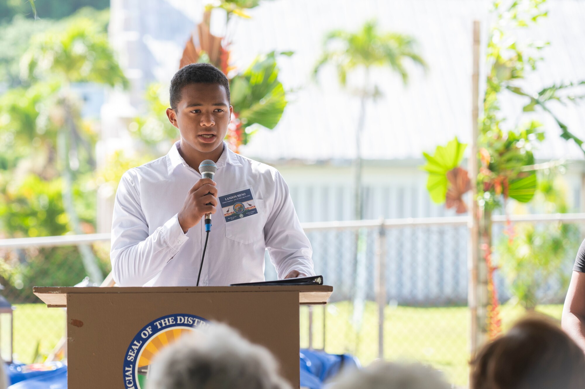 A man speaking to a crowd.
