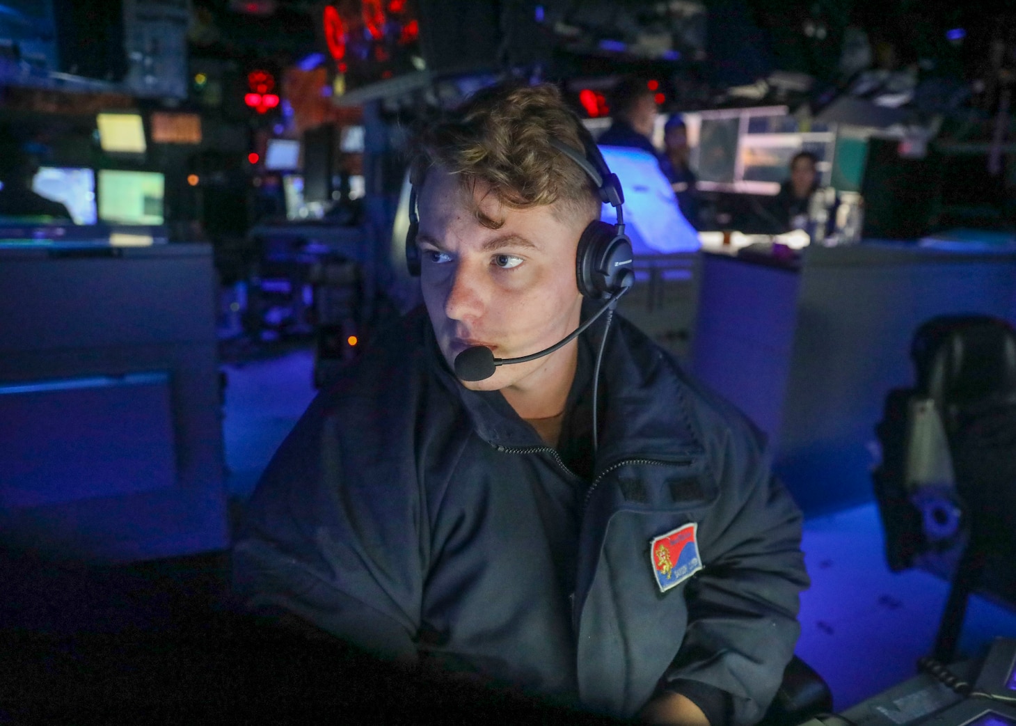 SOUTH CHINA SEA (July 13, 2022) Gunner’s Mate 2nd Class Dawson Cooper, from Clawson, Michigan, monitors surface contacts from the combat information center as the guided-missile destroyer USS Benfold (DDG 65) conducts routine underway operations. Benfold is forward-deployed to the U.S. 7th Fleet area of operations in support of a free and open Indo-Pacific. (U.S. Navy photo by Mass Communication Specialist 2nd Class Arthur Rosen)